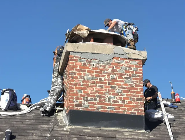 Portsmouth Chimney Sweep installing a custom chimney crown in Portsmouth, RI