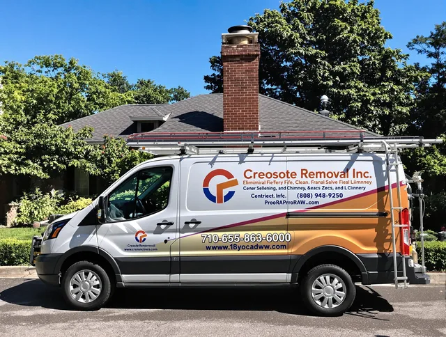 Portsmouth Chimney Sweep technician removing creosote safely in Portsmouth, RI