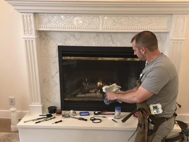 Portsmouth Chimney Sweep performing fireplace maintenance in Portsmouth, RI