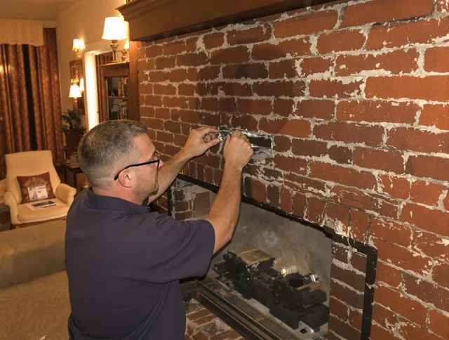 Portsmouth Chimney Sweep expert fixing a fireplace in Portsmouth, RI